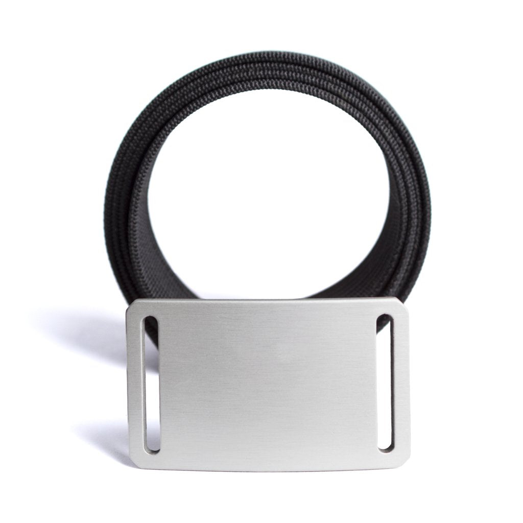 silver belt buckle in front of black belt strap